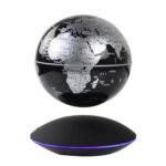 Modern black and white world map globe with a wireless charging base, ideal for educational and decorative purposes.