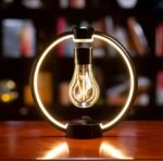 Modern LED light bulb lamp with circular frame, perfect for science-themed decor and educational spaces, creating a warm and innovative atmosphere.