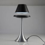 LED desk lamp with adjustable head, sleek metallic finish, and modern design for efficient workspace illumination.