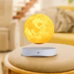 Moon lamp with a realistic lunar surface design, emitting a warm yellow glow, placed on a white base on a cozy living room table.