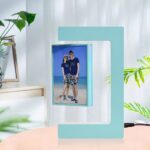 Modern digital photo frame with a blue frame displaying a beach photo, perfect for home decor and personalized photo sharing.