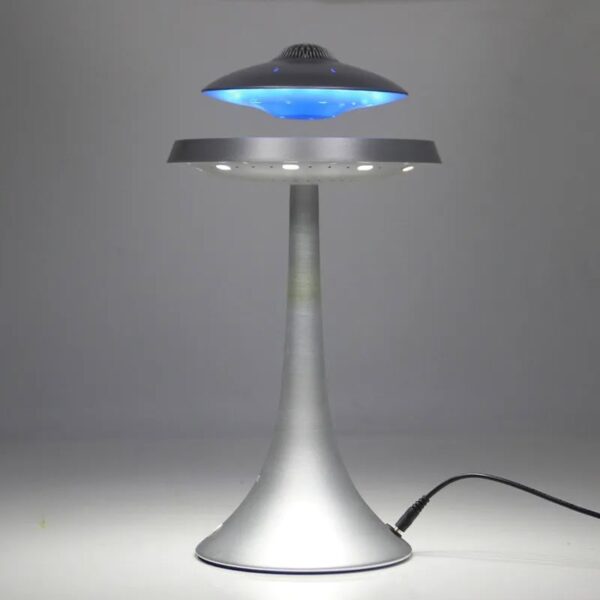 Modern UFO-shaped LED desk lamp emitting blue light, ideal for science decor and educational spaces.