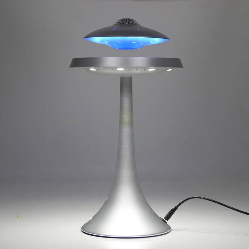 UFO-shaped LED Desk Lamp with Blue Light Modern UFO-shaped LED desk lamp emitting blue light, ideal for science decor and educational spaces.