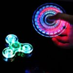 LED-lit fidget spinner spinning in the dark.