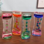 Brightly colored liquid-filled hourglasses with floating bubbles, ideal for science experiments, classroom decor, or as fun educational toys.