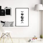 Elegant black and white moon phases wall art displayed in a minimalist living room, adding a celestial touch to contemporary home decor.