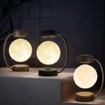 Modern moon-shaped LED lamps with gold accents, perfect for home decor and ambient lighting.