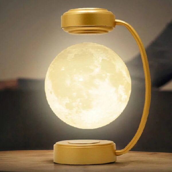 Decorative moon lamp with a glowing surface, mounted on a stylish gold stand, creating a celestial ambiance perfect for home decor or educational displays.