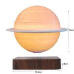 A planet-shaped lamp resembling Saturn with a glowing surface and a ring, mounted on a wooden base, measuring 14cm in height and 13.4cm in diameter.