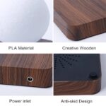 Close-up of a wooden science gadget base with anti-skid design, power inlet, and creative wooden finish, showcasing durable materials for educational and decorative purposes.