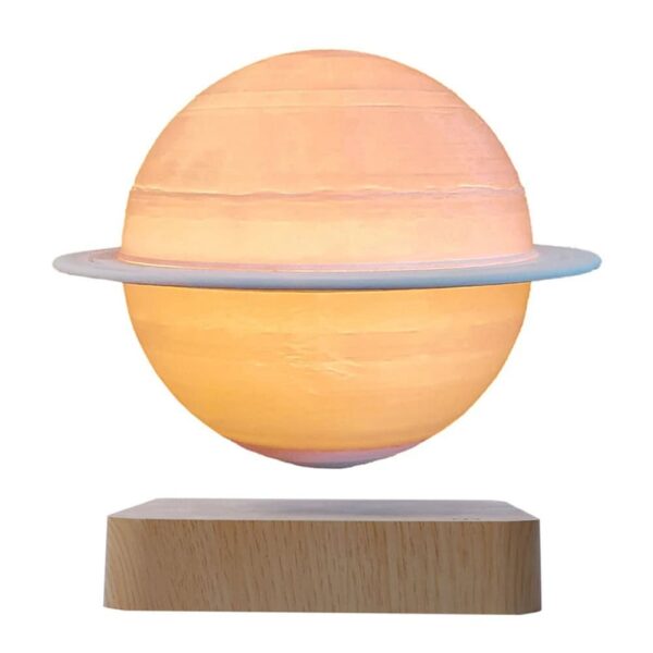 Sun planet lamp with a ring, glowing softly, on wooden base.