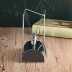 Newton's Cradle demonstrating conservation of momentum and energy, perfect for science classrooms and home experiments.