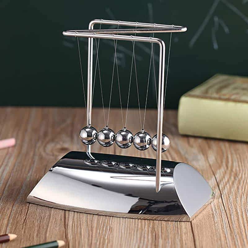 Newton's Cradle metal ball toy for demonstrating momentum and energy transfer in physics. Perfect as a science decor or educational toy for classrooms and offices.