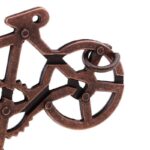 Metal bike gear puzzle toy demonstrating mechanical engineering principles, ideal for science and educational displays.