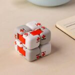 Innovative 3D puzzle cube with interlocking white and orange pieces, perfect for developing problem-solving skills and spatial awareness in children and adults.