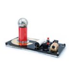 Educational electromagnetic experiment kit with a metal sphere, coil, and power supply for science learning and demonstrations.