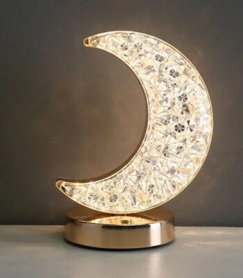 Decorative crystal moon night light with gold base, perfect for adding a magical touch to bedrooms or living spaces. Crafted with sparkling crystals and a sleek gold stand, it creates a calming glow.