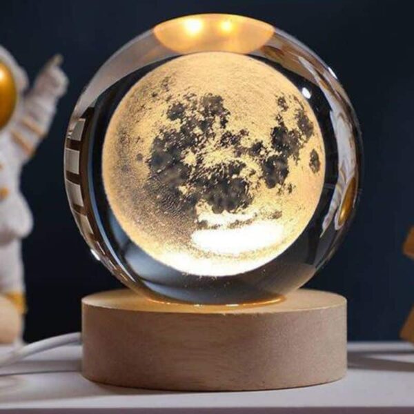A moon globe lamp with a detailed lunar surface design, serving as an educational decor piece and night light. Perfect for science enthusiasts and space lovers.