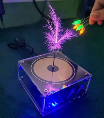 A magnetic levitation device with colorful LED lights, showcasing a floating feather and glowing wires, demonstrating magnetic and electrical principles for educational purposes.