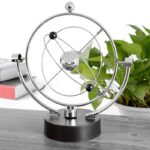 Modern metallic solar system model with orbiting planets, ideal for science education and decor.