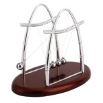 Elegant metallic Newton's Cradle with five swinging spheres on a wooden base, ideal for physics demonstrations and office decor.