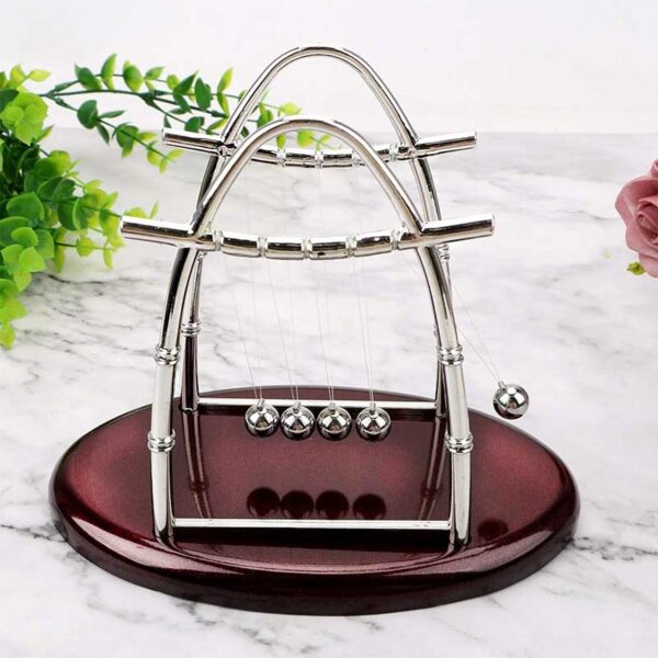 Elegant miniature Newton's Cradle for desk decoration and educational display.