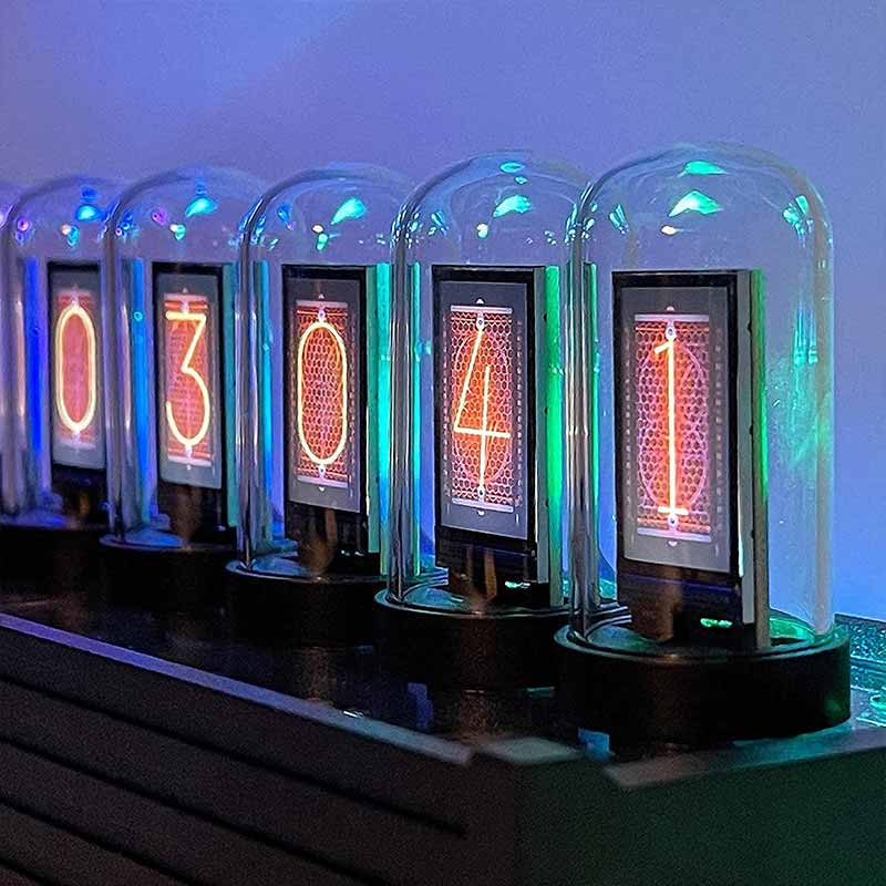 Nixie Tube Number Display in a Science Gadget Nixie tube number display showing the digits 0 to 4, encased in glass tubes with colorful LED lighting, used as a decorative and educational science gadget.