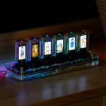 Nixie tube-style digital display with animated characters illuminated by colorful LED lights.