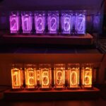 Vintage Nixie tube number display set with glowing digits in purple and orange, perfect for science decor and educational toys.