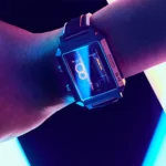 A futuristic digital watch displaying neon blue and purple lights on a wrist, showcasing modern science-inspired design and technology.