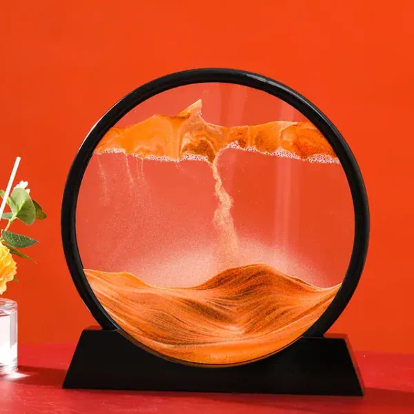 A mesmerizing sand and water science experiment featuring a circular glass container with flowing sand and water, creating dynamic patterns and miniature landscapes.