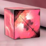 Vibrant pink abstract art cube with dynamic brushstrokes, perfect for science decor and educational display.