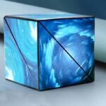 Blue swirling cube with abstract cosmic design.