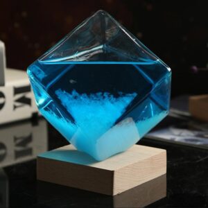 Colorful chemical reaction in a glass container with blue liquid and white precipitate, demonstrating a science experiment.