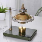 Innovative scientific apparatus with a brass sphere and mechanical components for educational demonstrations.