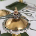 Precision magnetic stirrer with gold-colored top and stainless steel components, ideal for scientific experiments and laboratory mixing applications.
