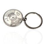 Metal keychain featuring a circular Sun and Moon calendar with detailed date and time markings, ideal for educational purposes and science enthusiasts.