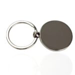 Compact magnetic keychain featuring a round metal tag, ideal for organizing keys or as a stylish accessory. Durable and lightweight design for everyday use.