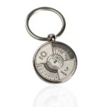 Metal keychain featuring a sun and moon phase design with calendar and astronomical information, ideal for science enthusiasts and educational purposes.