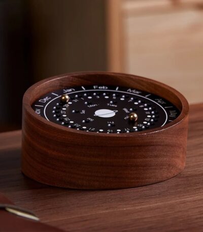 A wooden perpetual calendar featuring rotating month and date dials, perfect for organizing dates in a stylish and eco-friendly way on your desk.