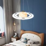 Modern bedroom with science-themed decor and lighting fixture resembling a planetary orbit.