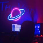 Neon Saturn planet wall decor with glowing rings, ideal for science-themed rooms or educational spaces. Bright, colorful, and eye-catching for a modern science decor setup.