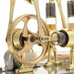 Steam engine model demonstrating basic principles of thermodynamics and mechanical motion. Perfect for science enthusiasts and educational purposes.