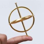 Gold Gyroscope Toy for Science Enthusiasts and Educational Use.