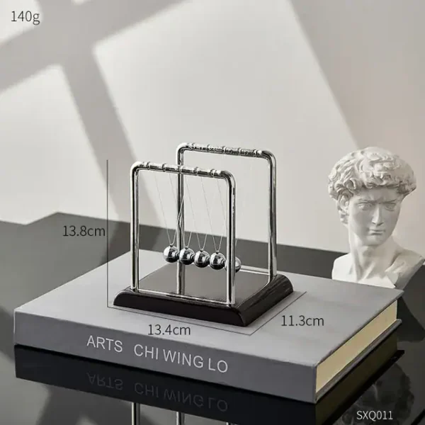 An elegant Newton's Cradle with five metallic balls demonstrating conservation of momentum and energy, perfect for science education and decor.