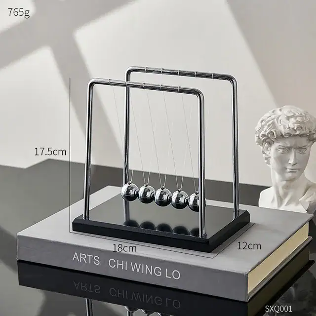 Elegant Newton's Cradle desktop toy with five metallic balls demonstrating physics principles. Perfect for science decor and educational purposes.