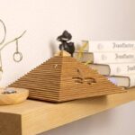 Intricate wooden pyramid model with layered steps, perfect for science enthusiasts and educational displays.