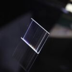 Close-up of a transparent LCD screen displaying colorful lines, ideal for science education and experiments.