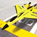 Detailed yellow fighter jet model with black accents, labeled "CHINA AIR FORCE" and "SU-35," designed for educational and display purposes.