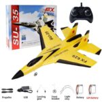 Yellow SU-35 RC jet model with black nose, landing gear, and red star markings, accompanied by a remote control, batteries, and accessories for educational and hobby use.